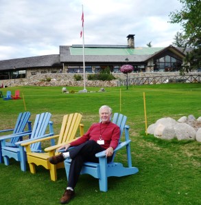 Jasper Lodge from Beavert Lake, with happy tourist